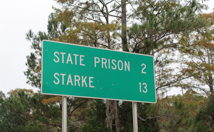 A sign marks the state prison on the road leading to Union Correctional Institution outside Raiford, Florida, on Tuesday, Oct. 28.