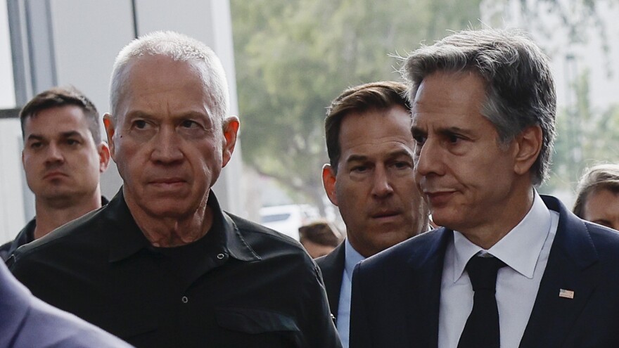 U.S. Secretary of State Antony Blinken and Israeli Cabinet Minister Benny Gantz, left, walk as they meet during his week-long trip aimed at calming tensions across the Middle East in Tel Aviv, Israel, on Tuesday.