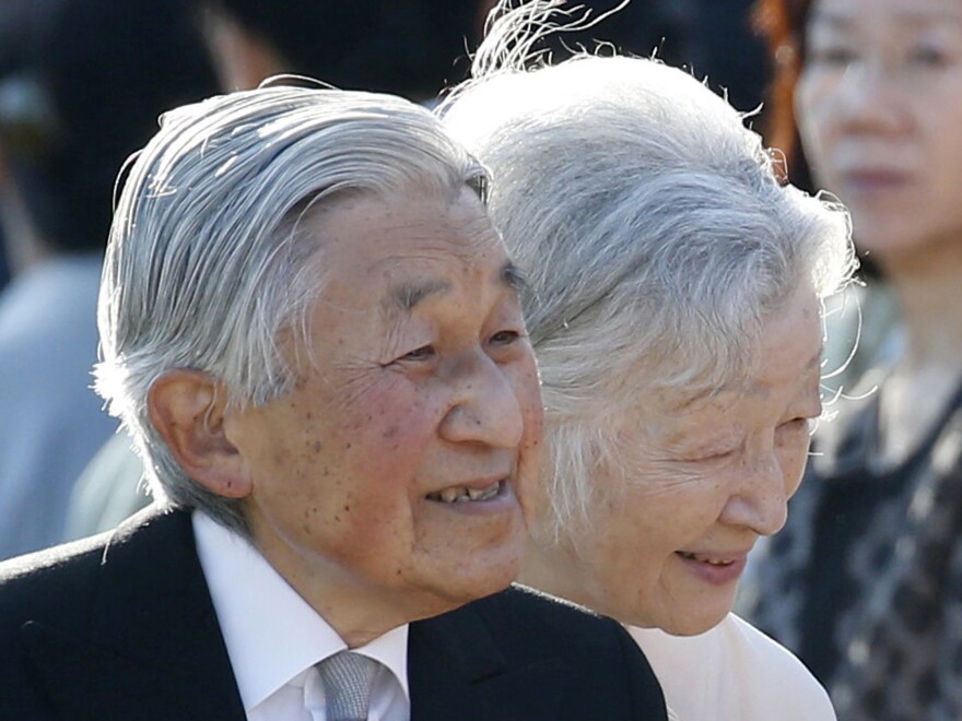 Japan's Emperor Akihito, left, and Empress Michiko, greet guests during the annual autumn garden party at the Akasaka Palace imperial garden in Tokyo earlier this month.