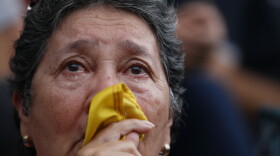 An anti-government demonstrator cries during a vigil in honor of those who have been killed during clashes between security forces and demonstrators in Caracas, Venezuela, Monday, July 31, 2017.