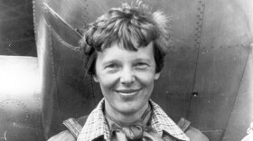 File photo of Amelia Earhart beneath the nose of her Lockheed Model 10 Electra in Oakland, California, in March 1937.