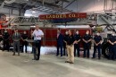 Keith Powers speaking at a podium with a firetruck and firefighters behind him. Mayor Lenny Curry to his left, speaking in a fire station