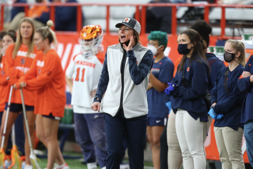 Syracuse Head Coach Kayla Treanor calls out signals on the sidelines. 