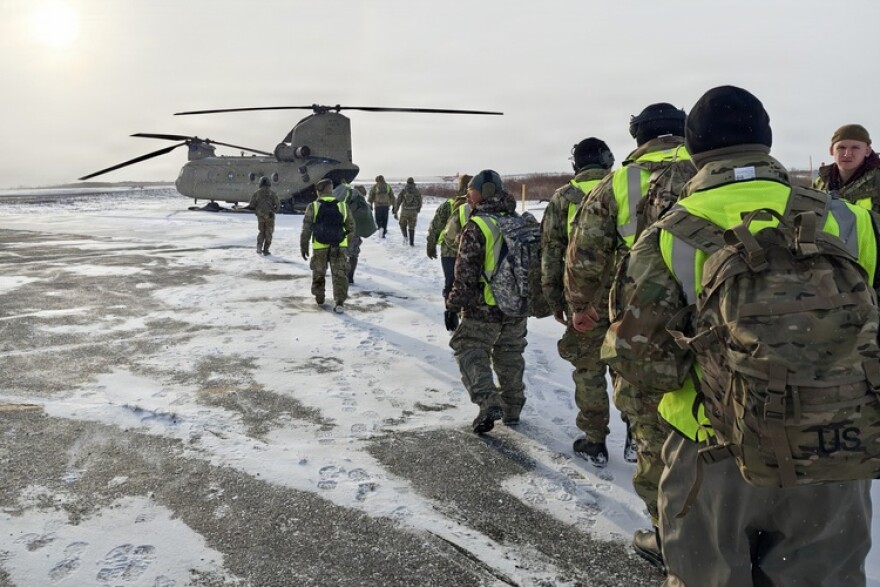 Members of the Alaska Organized Militia board an Alaska Army National Guard CH-47 Chinook helicopter, assigned to the 207th Aviation Troop Command, while traveling from Bethel to Tuntutuliak, Alaska, during storm response operations after Typhoon Halong on Oct. 23, 2025. (Courtesy photo)