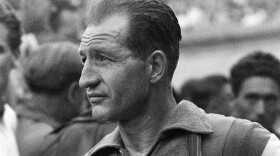 Italian cycling great Gino Bartali in 1953. During the German occupation of Italy, the champion cyclist aided the Jewish-Christian rescue network in his hometown of Florence and the surrounding area by shuffling forged documents and papers hidden in the tubes and seat of his bike. Bartali, who died in 2000, rarely spoke about it for the rest of his life, but his son Andrea Bartali led an effort to gain recognition for what his father did. (AP Photo)