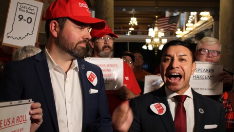 Lt. Governor Micah Beckwith (left) and Secretary of State Diego Morales (right) joined a group of people at the Indiana Statehouse on Tuesday, Nov. 18 in a rally to support new congressional maps that favor Republicans.