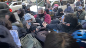 Masked ICE agents detain an unidentified man and clash with community members