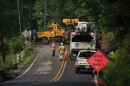 Workers try to clean the route impacted by recent storms and flooding on Monday, July 17, 2023. Belvidere, New Jersey. (AP Photo/Eduardo Munoz Alvarez)