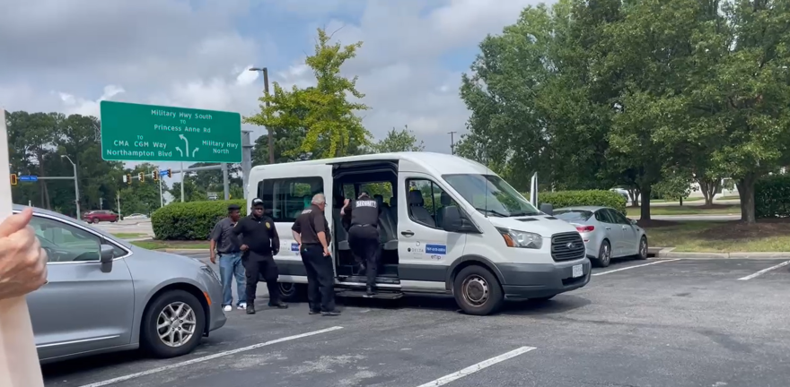 Activists said security officers loaded four Filipino cruise ship workers into a bus bound for Norfolk International Airport Monday morning after they were detained overnight by U.S. Customs and Border Protection.