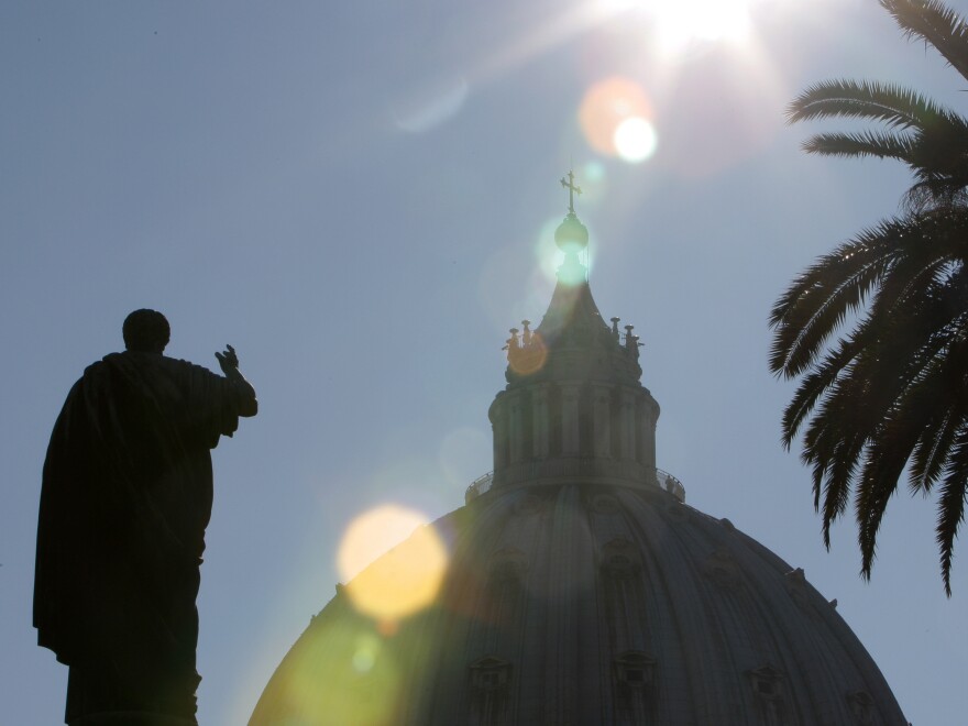 St. Peter's statue in front of St. Peter's Basilica at the Vatican.