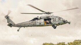 An MH-60S Seahawk assigned to Helicopter Sea Combat Squadron 25 prepares to land at Joint Region Marianas headquarters to transport senior leaders for an aerial tour of critical infrastructure sites across Guam on July 23, 2025.