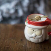 The Snow Angels, Ice Skating, Cookie Dough & Snuggles cocktail is served in a Santa Claus mug at Miracle on Seventh Street, a pop-up holiday cocktail bar in Washington, D.C. The cocktail contains butter-washed vodka, coffee liqueur, creme de cacao, hazelnut liqueur, half-and-half and salt. It's served with a little ball of egg-free cookie dough as garnish.