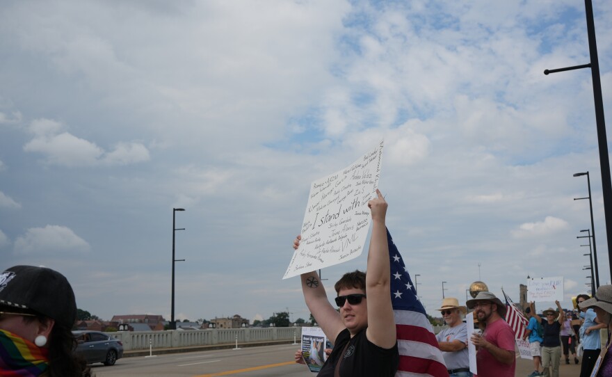Demonstrators participate in Indivisible Knoxville’s Labor of Love protest on Henley Street Bridge in Knoxville on September 1, 2025.