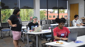 Paul Chin, left, helps Belinda Terry, center, with her code on HTML Day during an event hosted by 757 Tech on Aug. 8, 2026.