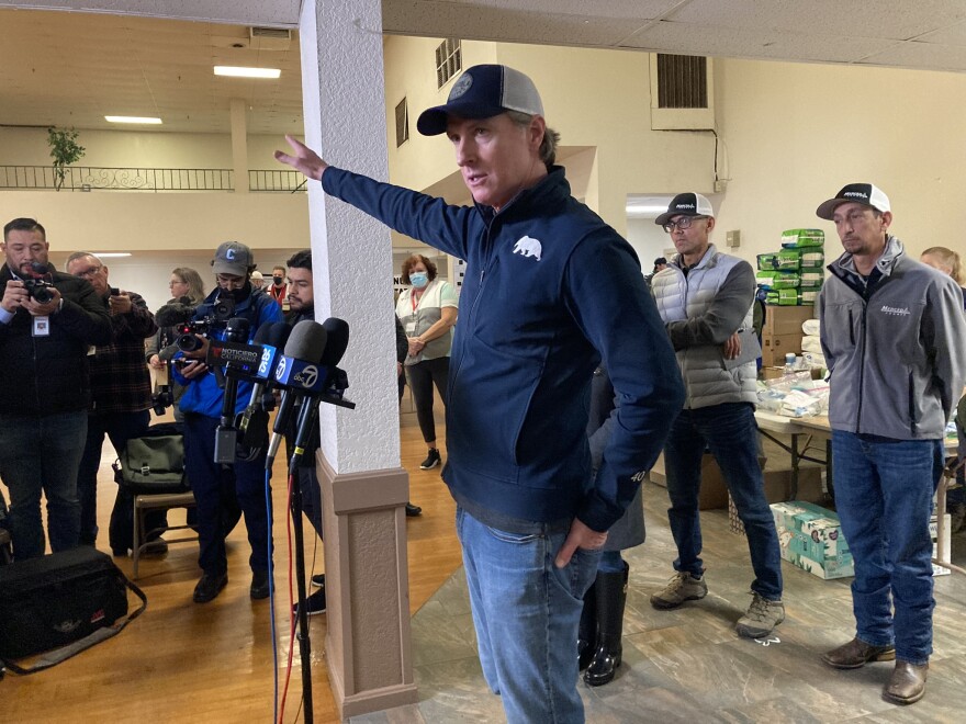 Gov. Gavin Newsom speaks to reporters after meeting Merced County authorities and visiting with residents affected by flooding during a stop at the Merced County Fairgrounds on Saturday, Jan. 14, 2023.