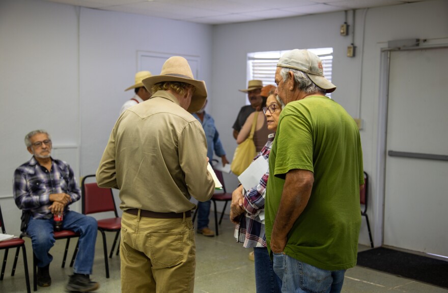 David Keller, with the advocacy group No Big Bend Wall, collects contact information from Redford residents at a landowner meeting on March 9.