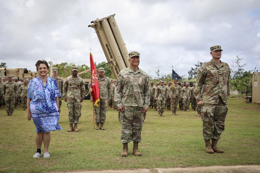 From left, Guam Gov. Lou Leon Guerrero, Brig. Gen. Michael Cruz, adjutant general, Guam National Guard, and Lt. Col. Jonathan Stafford, commander, Task Force Talon, visit with troops at the Terminal High Altitude Area Defense (THAAD) site, Guam, May 9, 2024.