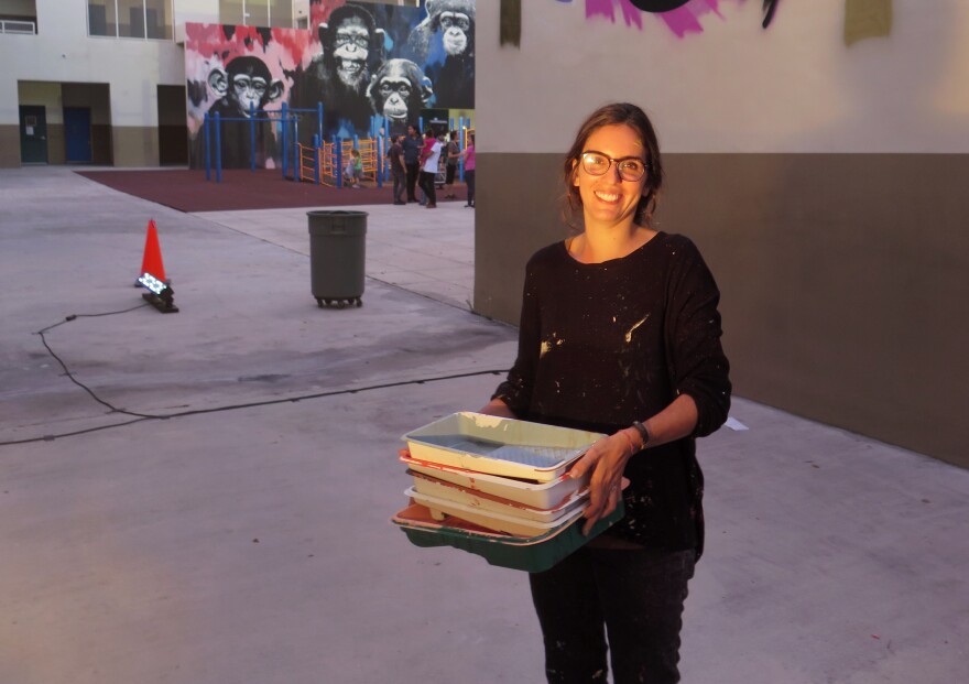 Marina Capdevila is one of dozens of artists who painted murals at Eneida Hartner Elementary School in Miami as part of a project called Reimagining the Arts in Wynwood.