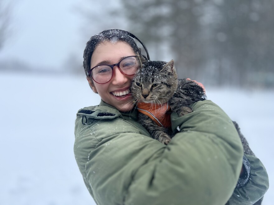 Nicky Dorati and her cat Fernie at Livingston Park in Manchester.