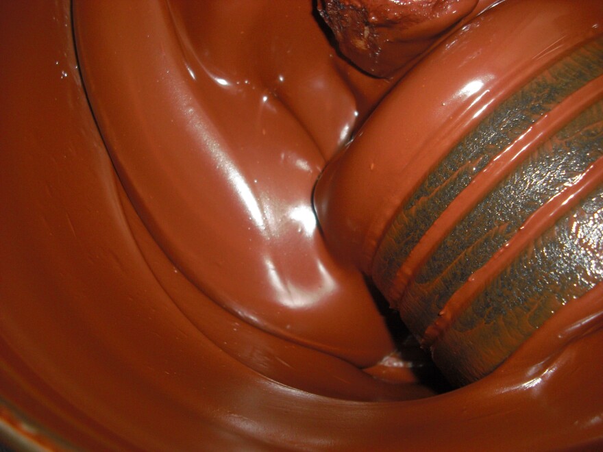 The length of the conching or grinding process determines the final smoothness and quality of the chocolate.