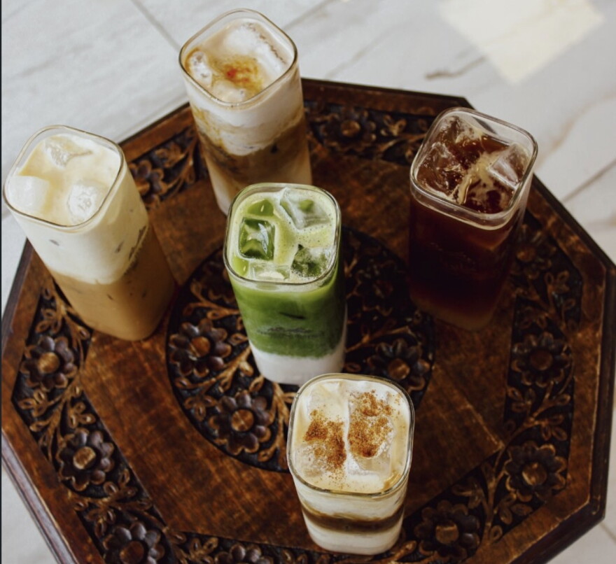 A table with a variety of iced coffee drinks