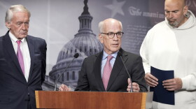 U.S. Sen. Peter Welch, D-Vt., center, speaks as Sen. Edward Markey, D-Mass., left and Sen. John Fetterman, D-Pa., right, listen during a news conference on the debt limit on Thursday, May 18, 2023, on Capitol Hill in Washington. Male senators are expected to wear a jacket and tie on the U.S. Senate floor, but Fetterman has a workaround: He votes from the doorway of the Democratic cloakroom or the side entrance, making sure his “yay” or “nay” is recorded before ducking back out. 