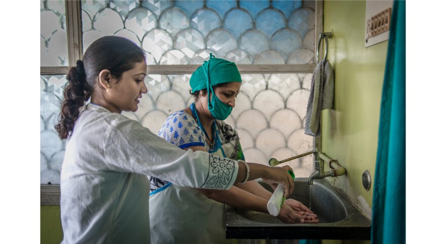 Dr. Mahesh prepares to carry out an abortion for Palo Khoya. "They just come because they don't want to continue the pregnancy," the doctor says. "They're not bothered whether it's legal or not legal. But we're doing awareness campaigns to tell them it's legal, it's not wrong, to get rid of the stigma attached to it."