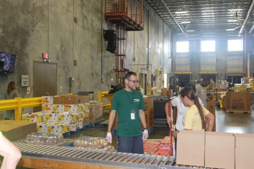 Second Harvest Food Bank volunteers pack boxes for Hurricane Michael.