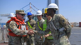 Sergeant Major of the Army Michael Weimer, left, greets Soldiers assigned to 7th Transportation Brigade (Expeditionary) on the main deck of the MV Roy P. Benavidez, in the Port of Ashdod, Israel