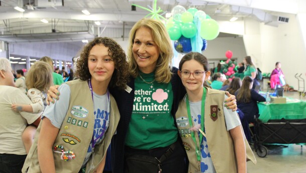 Diane Nelson, CEO of Girl Scouts of Eastern Iowa and Western Illinois, with members of Troop 2548 at Journey the World, the council’s largest event.
