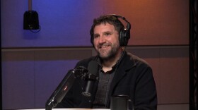 Tyler Lake is shown in Metz Studio recording a podcast episode