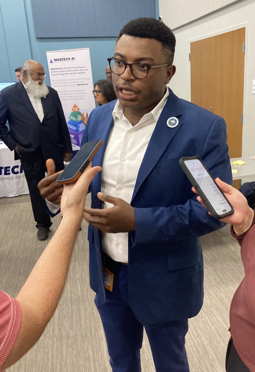 Man at the open house being interviewed