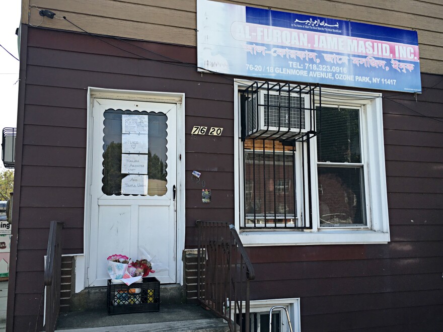 Bangladeshi imam Maulama Akonjee and an associate were shot from behind on a busy street on a Saturday afternoon. Signs reading "Rest in Peace" adorn the door of Al-Furqan Jame Masjid, where Akonjee was the imam, in Ozone Park, Queens.