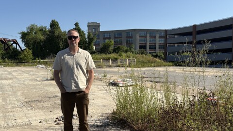 Tyler Norod, president of the Westbrook Housing Development Corporation, stands at the future site of Quebec Commons, a 45-unit apartment building for older Mainers that's planned for Biddeford's historic mill district.