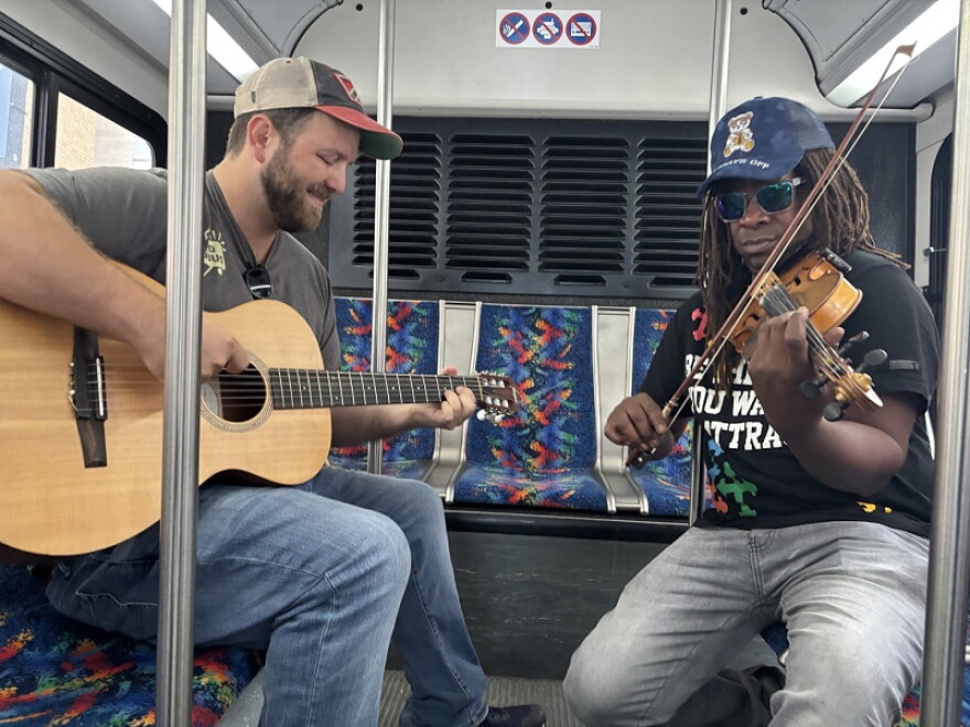 Musicians Nick Rose and Preston Charles the Third entertained commuters on TANK buses for a day.