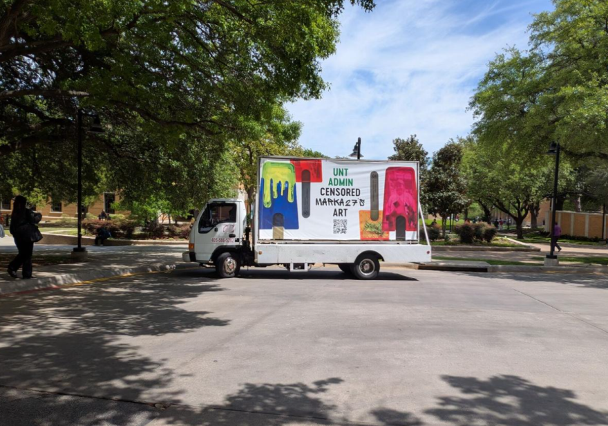 The ACLU of Texas, National Coalition Against Censorship and street artist Victor Quiñonez teamed up to launch a mobile billboard campaign calling out UNT leaders for removing an art exhibit critical of ICE earlier this year. It is pictured Tuesday outside the Hurley Administration Building, which houses UNT President Harrison Keller's office.