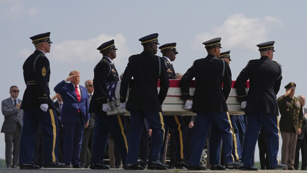 President Donald Trump salutes as a U.S. Army carry team moves a transfer case containing the remains of Pvt. Isabella Gonzales of Carrollton, Texas, Wednesday, July 22, 2026, at Dover Air Force Base, Del.
