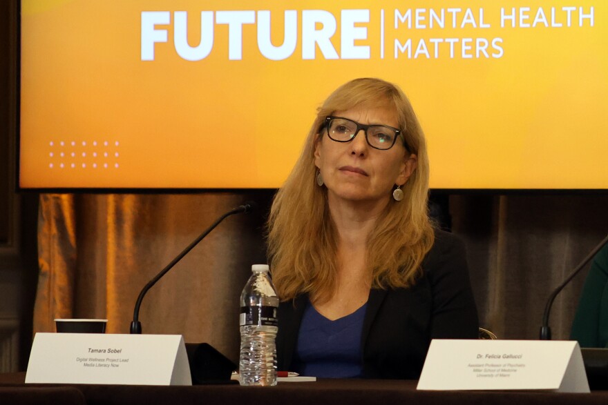 Tamara Sobel, digital wellness project lead for Media Literacy Now, listens to another panelist at the Youth Mental Health Roundtable in Coconut Grove Oct. 8, 2025.