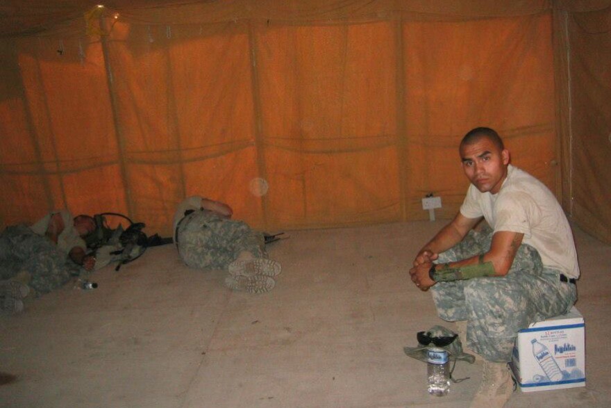 Jesus Medina rests in a tent with other soldiers in Iraq.