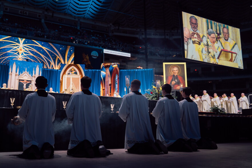 Seminarians kneel during the consecration at the beatification Mass for the late Archbishop Fulton J. Sheen on Thursday at the Dome at America's Center in downtown St. Louis.