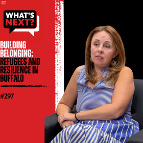 Background from left to right: red, then a vertical, thick white stripe in the middle, then black. from left to right: WN logo in the top corner, "BUILDING BELONGING:" in white text and "REFUGEES AND RESILIENCE IN BUFFALO" in black text over the red and then a photo of Jennifer Rizzo-Choi on the right over the black