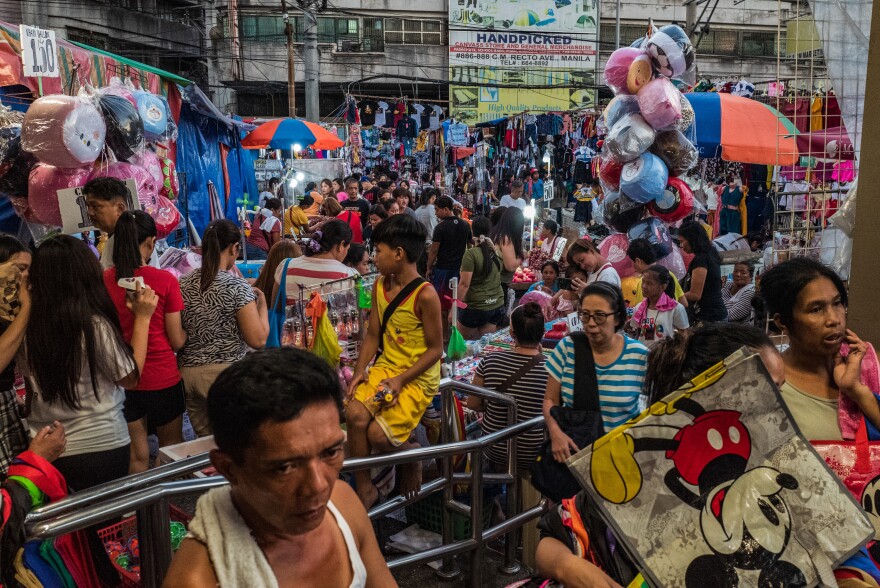Manila vies for the title of most densely populated city in the world. At the city's crowded markets, like the one above, increasing income has boosted the sales of consumer goods packaged in plastic.