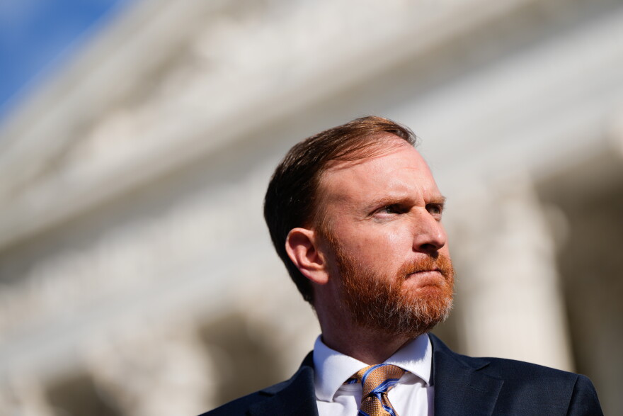 West Virginia Attorney General John McCuskey stands outside the Supreme Court after oral arguments, Jan. 13, 2026, in Washington.