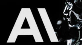 This photograph shows a figurine in front of the logo of the US artificial intelligence safety and research company Anthropic during a photo session in Paris on February 13, 2026. (Joel Saget / AFP via Getty Images)