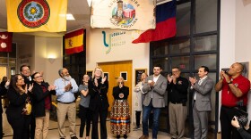 Appalachian State University Chancellor Sheri Everts claps with others during the unveiling of a Lumbee Tribal Flag at the Plemmons Student Union on February 27. Image credit: Chase Reynolds, courtesy of Appalachian State University