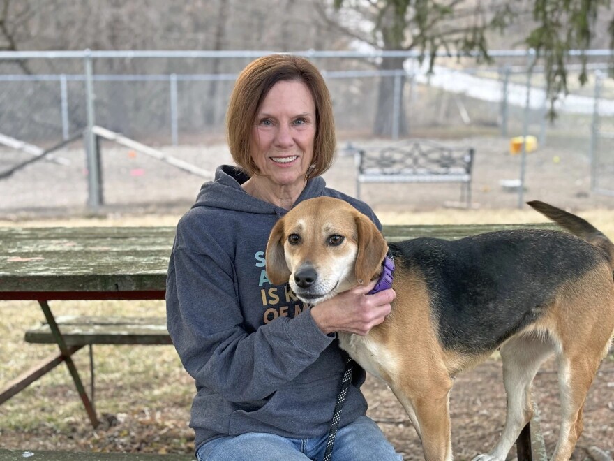 Bonnie Smith-Skripps, President of the Humane Society of McDonough County, in a photo from 2024 with Scooby, a one-year-old hound mix that came into the animal shelter as a stray and has since been adopted.