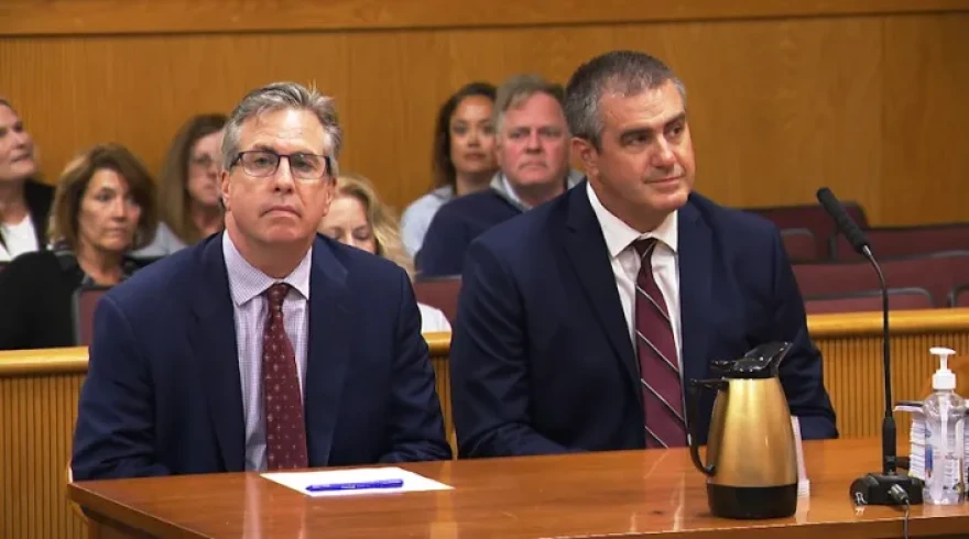Former North Kingstown High School boys basketball coach Aaron Thomas, right, and defense attorney John McDonald as the verdict in Thomas' trial is read on May 19, 2025.