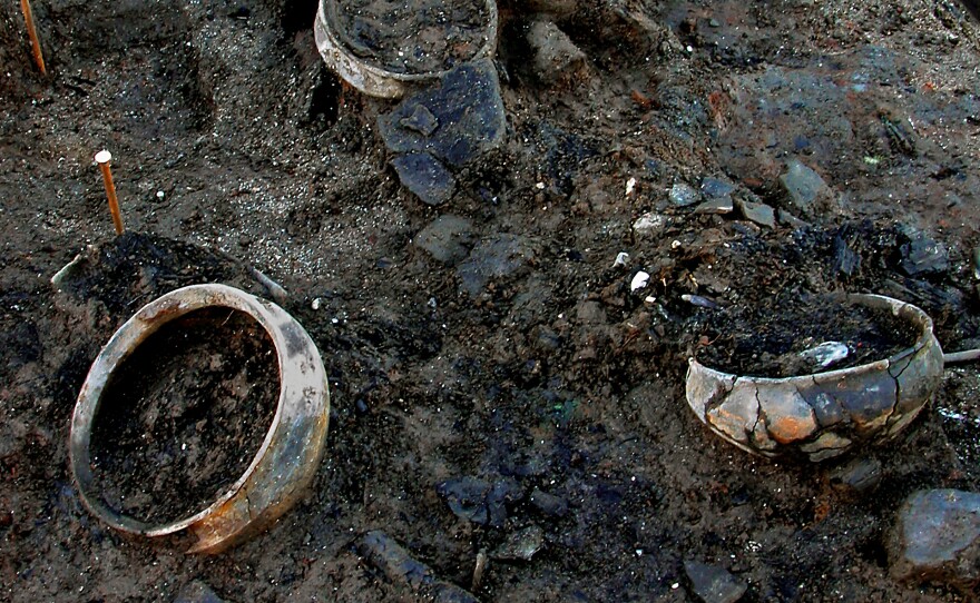 Whole pots were preserved inside timber dwellings destroyed by fire. Archaeologists discovered there was still food in some of them.