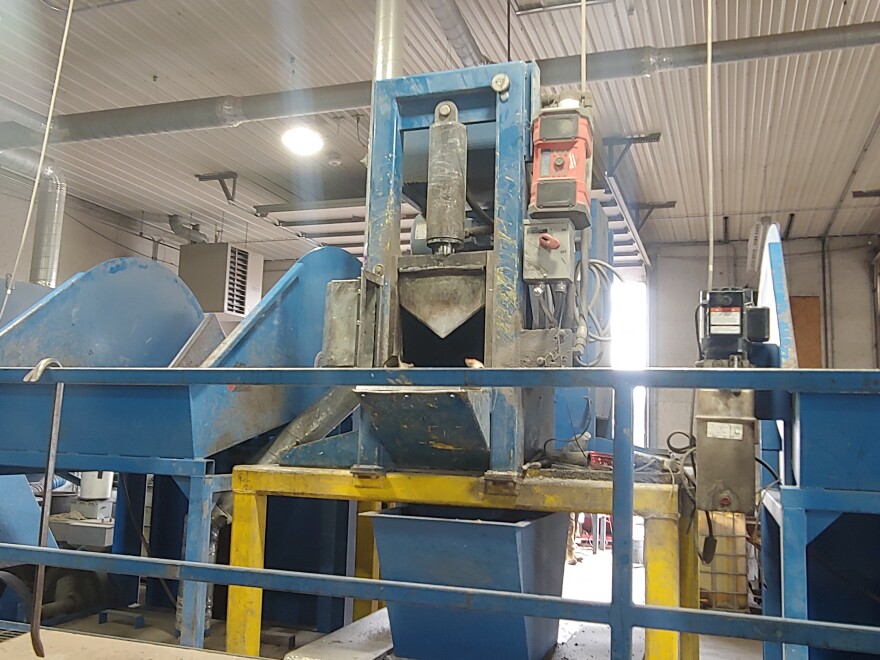 This shearing machine at AB Cattech in Burlington cuts the steel shell off discarded catalytic converters, and collects valuable metals for shipment to a refinery.