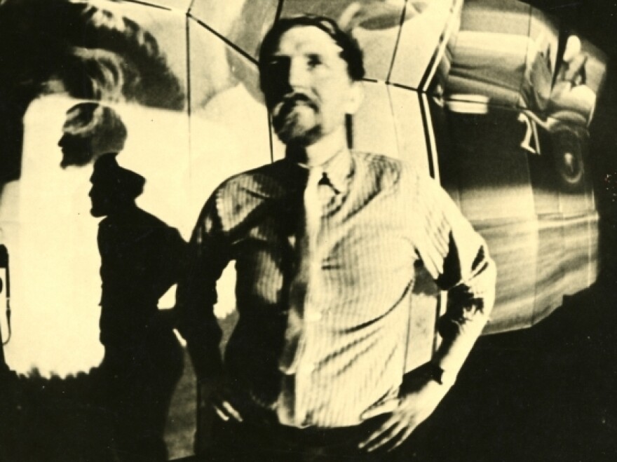 Stan VanDerBeek in front of <em>Movie Mural</em>. Installation view, Institute of  Contemporary Art, Boston, circa 1968